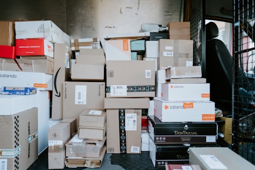 E-commerce seller packing shipping boxes